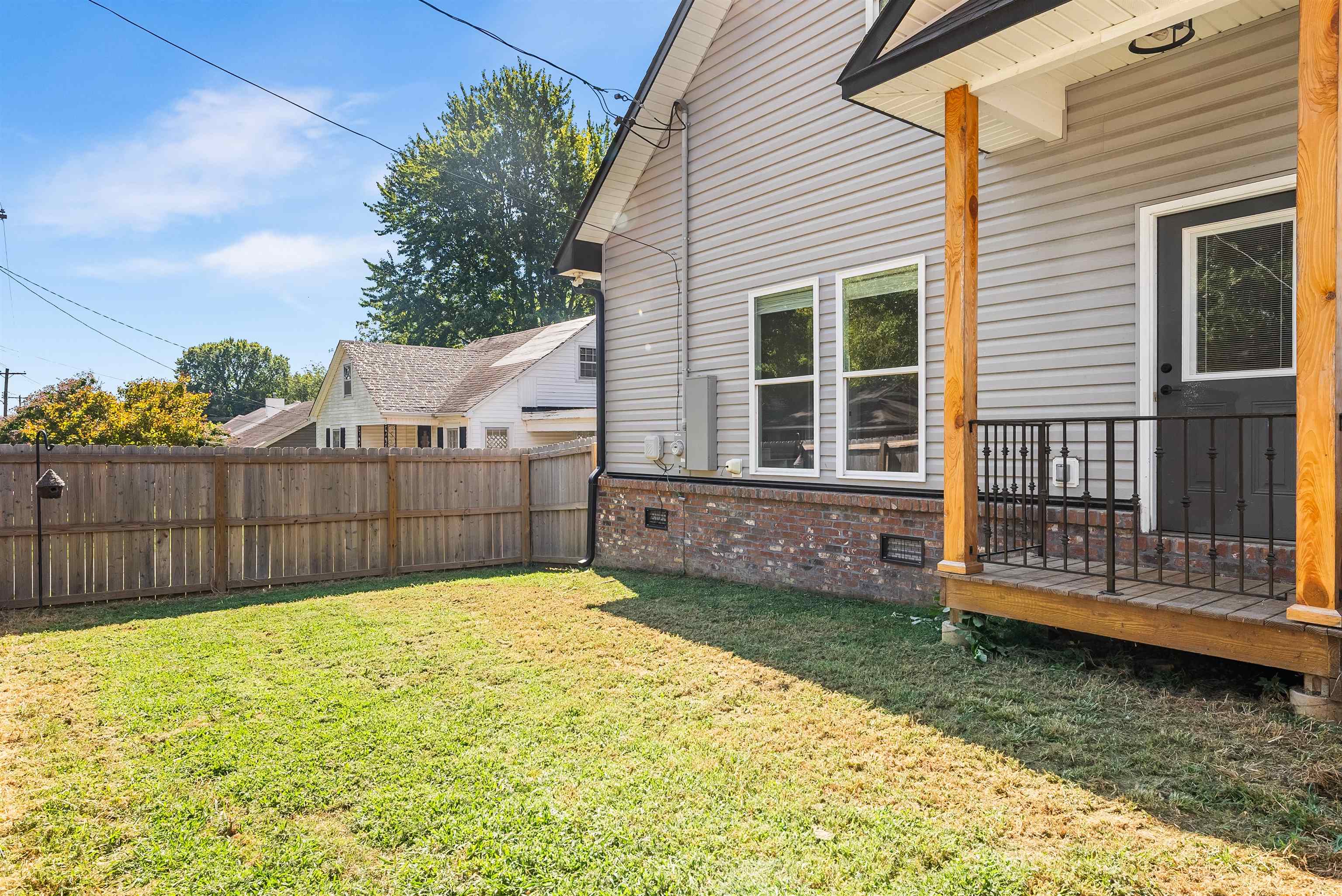 212 South Tipton Street Covington, TN 38019 - Photo 22 of 27 a view of a backyard with a garden
