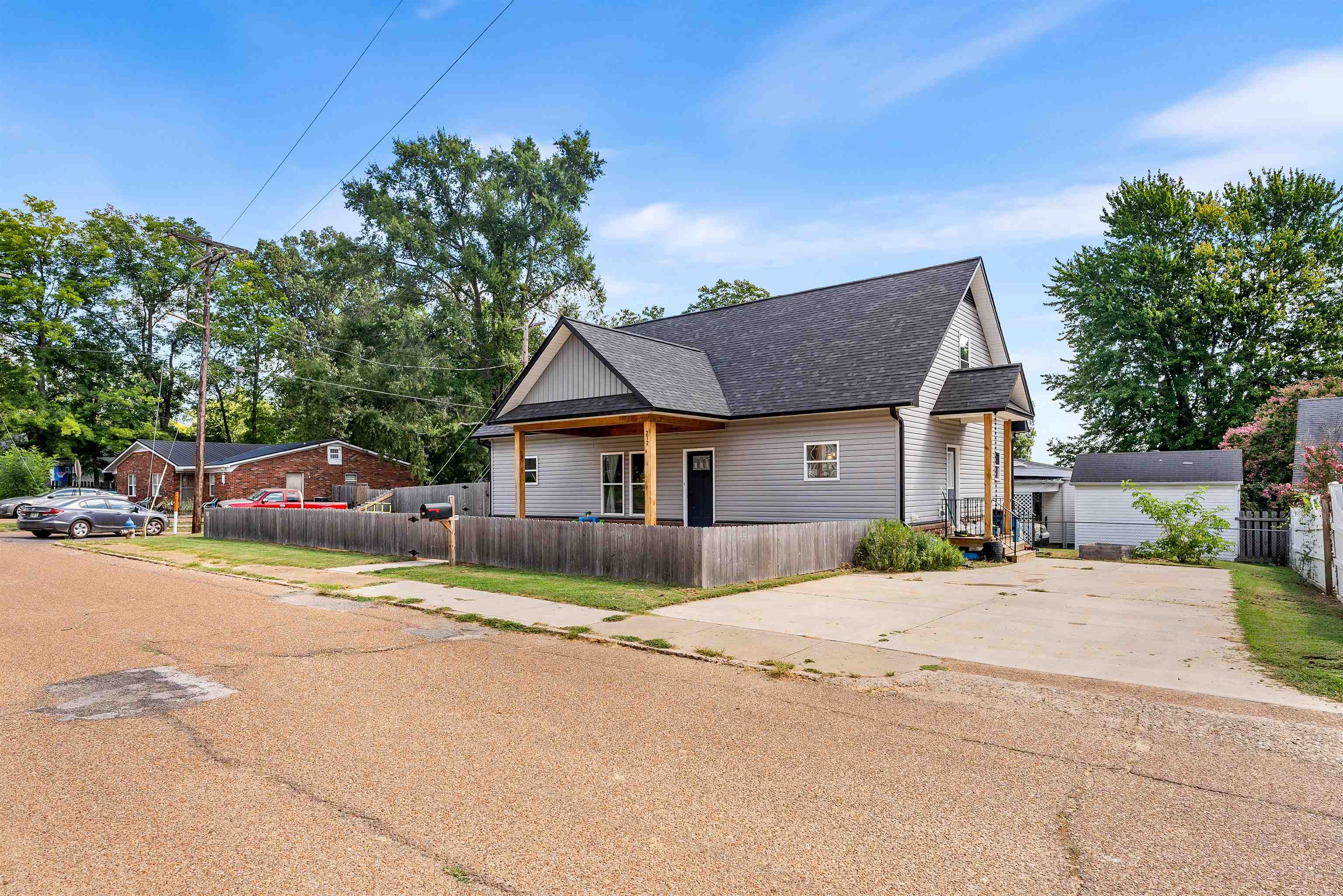 212 South Tipton Street Covington, TN 38019 - Photo 24 of 27 a front view of a house with a yard