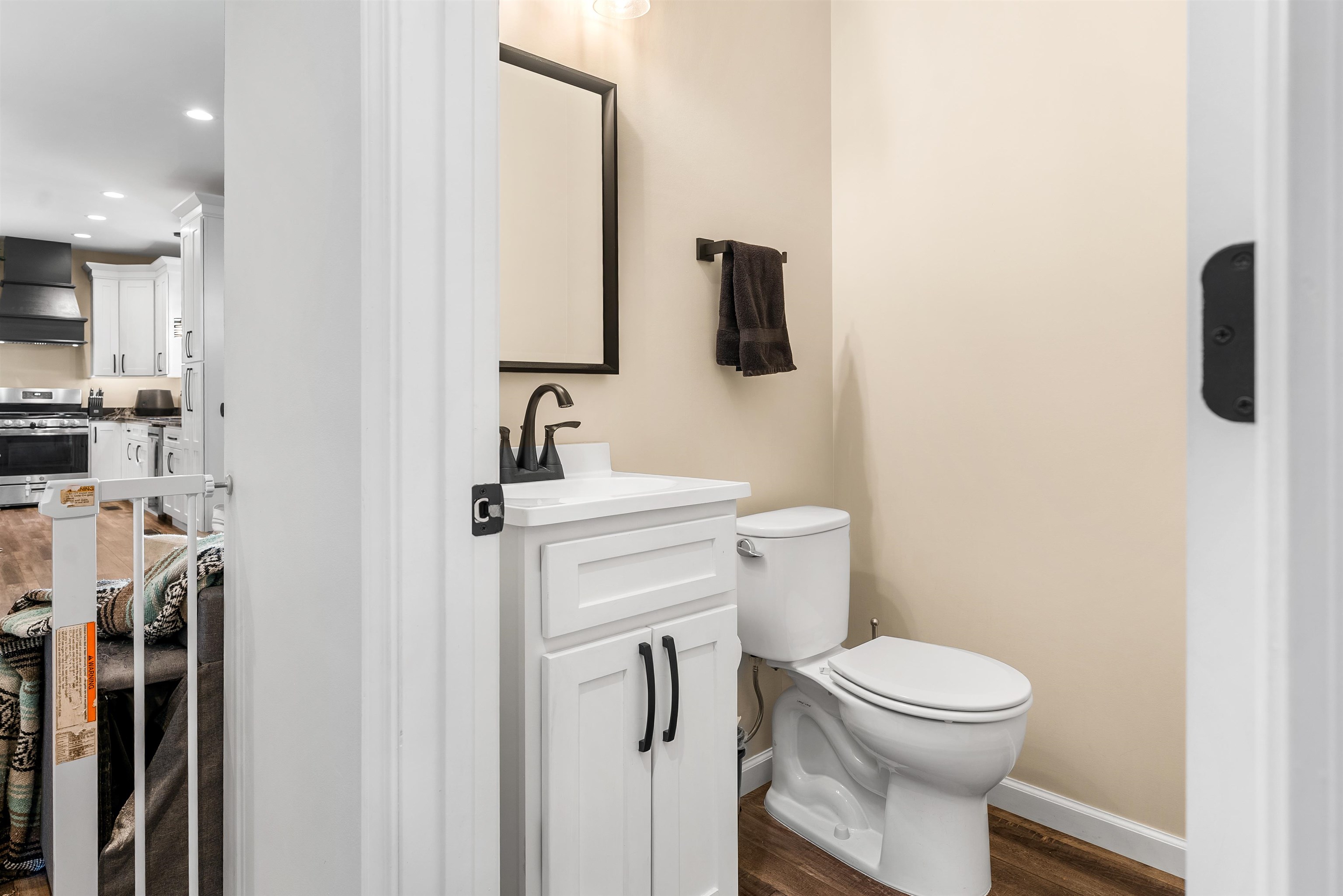 212 South Tipton Street Covington, TN 38019 - Photo 9 of 27 a bathroom with a toilet sink and mirror