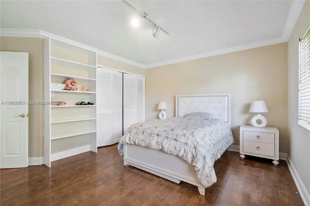 a bedroom with a bed and a closet
