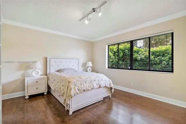 a bed room with a bed and a window