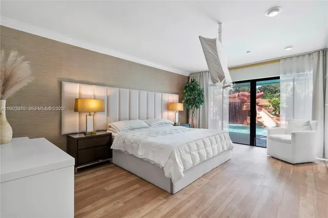 a bedroom with a large bed and a window