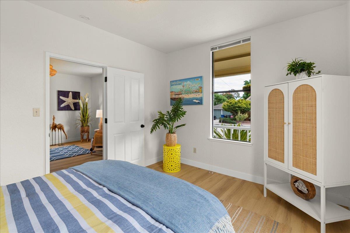 214 Rigg Street Santa Cruz, CA 95060 - Photo 17 of 32 a bedroom with a bed and a dresser
