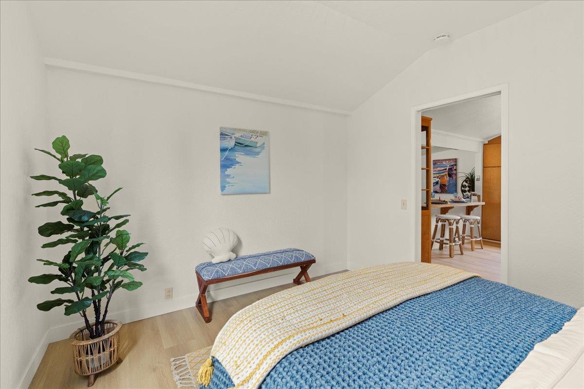 214 Rigg Street Santa Cruz, CA 95060 - Photo 19 of 32 a bedroom with a bed and a potted plant