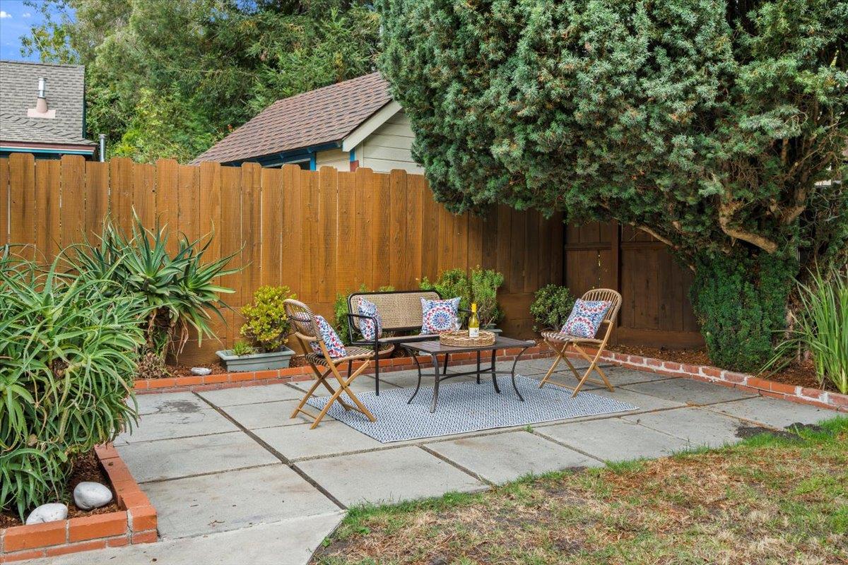 214 Rigg Street Santa Cruz, CA 95060 - Photo 27 of 32 a view of backyard with outdoor seating and trees