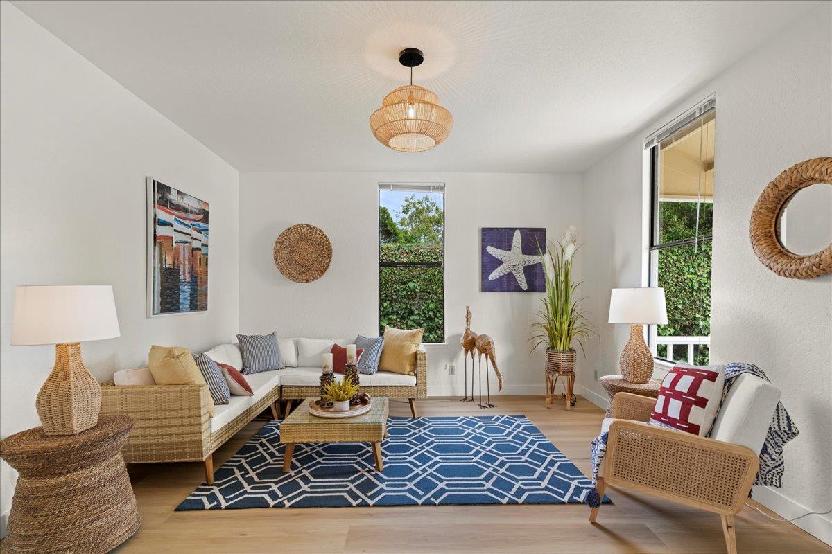 214 Rigg Street Santa Cruz, CA 95060 - Photo 6 of 32 a living room with furniture chandelier and a window