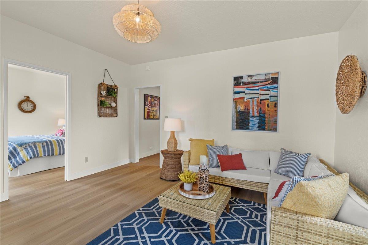 214 Rigg Street Santa Cruz, CA 95060 - Photo 8 of 32 a view of a dining room with furniture wooden floor and a chandelier