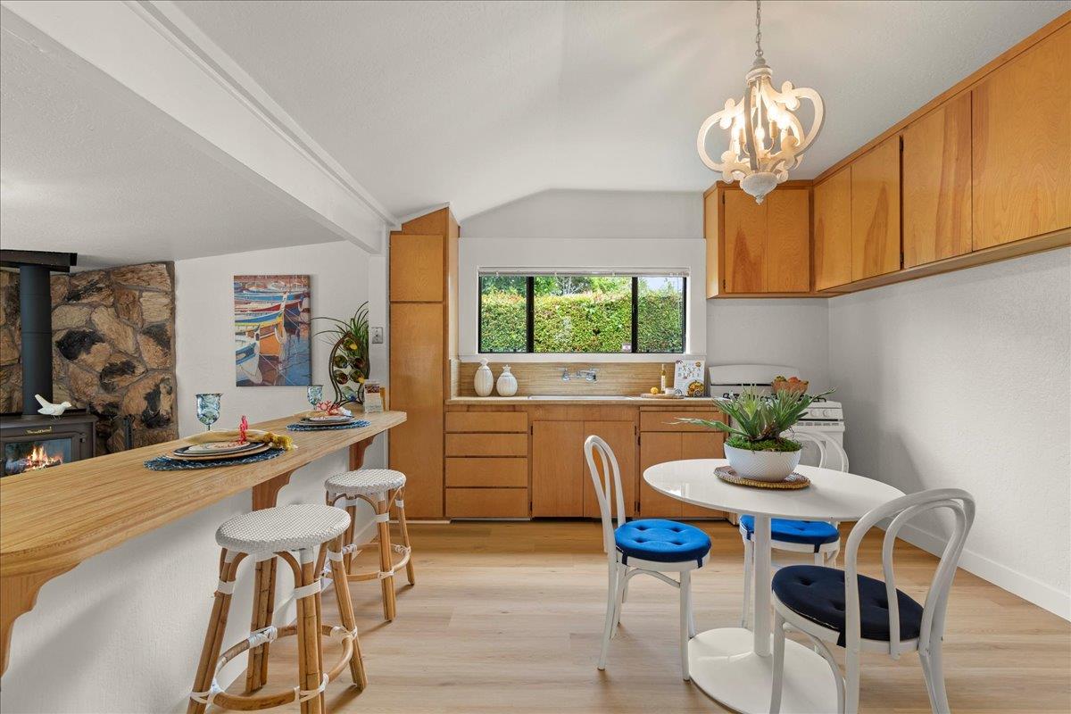 214 Rigg Street Santa Cruz, CA 95060 - Photo 10 of 32 a view of a dining room with furniture a chandelier and wooden floor