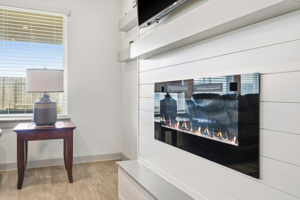 8210 Buck Lane Rosharon, TX 77583 - Photo 11 of 30 Modern fireplace feature creating a cozy focal point in the living space.