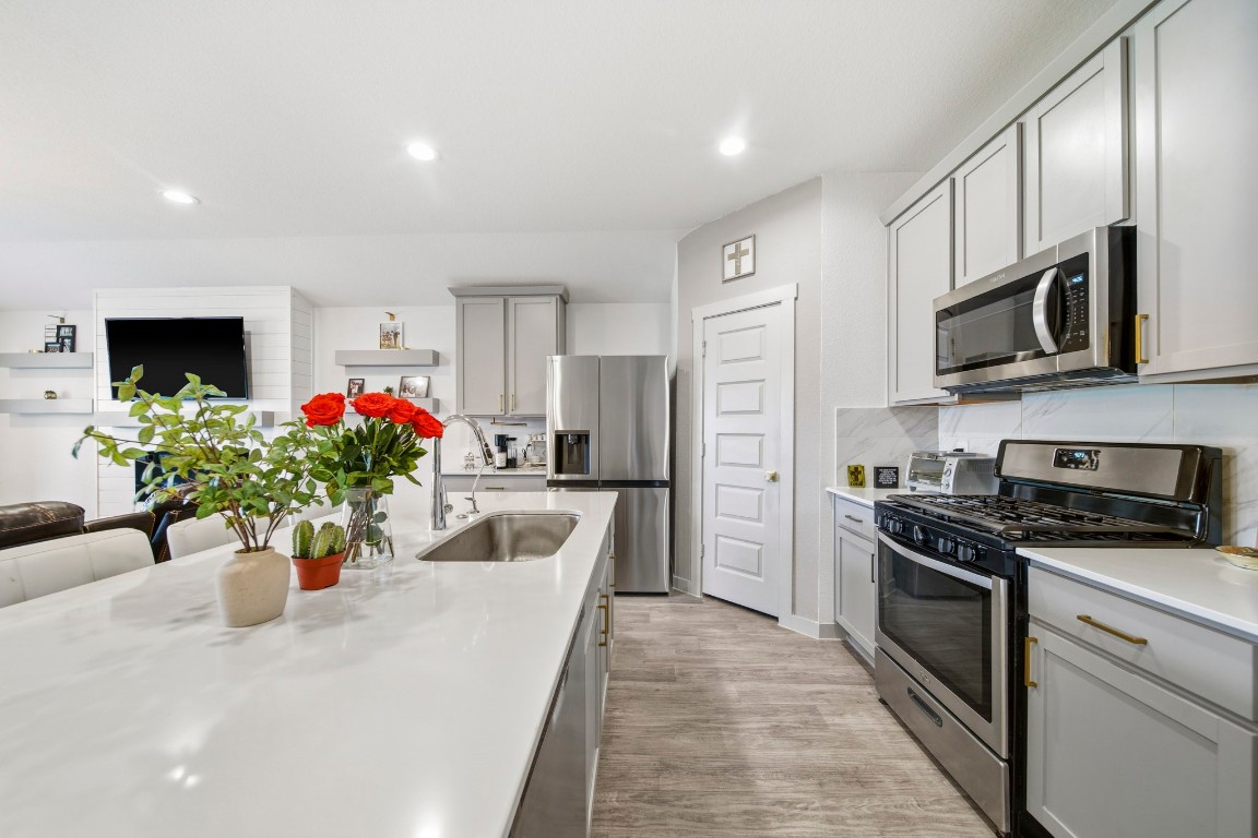 8210 Buck Lane Rosharon, TX 77583 - Photo 13 of 30 Modern kitchen with ample counter space and a practical layout for everyday cooking.