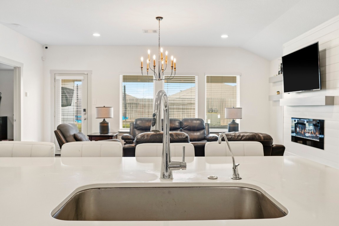 8210 Buck Lane Rosharon, TX 77583 - Photo 17 of 30 Kitchen view with an oversized island and clear sightlines into the living room.