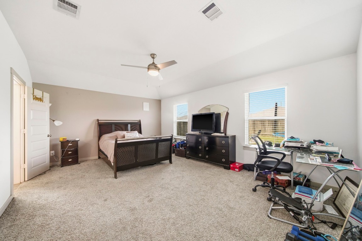 8210 Buck Lane Rosharon, TX 77583 - Photo 18 of 30 Spacious primary bedroom offering ample room for furniture and a comfortable layout.