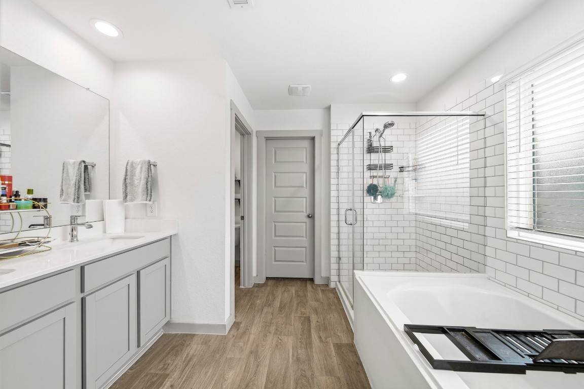 8210 Buck Lane Rosharon, TX 77583 - Photo 21 of 30 Primary bathroom featuring a large walk-in shower and separate soaking tub.