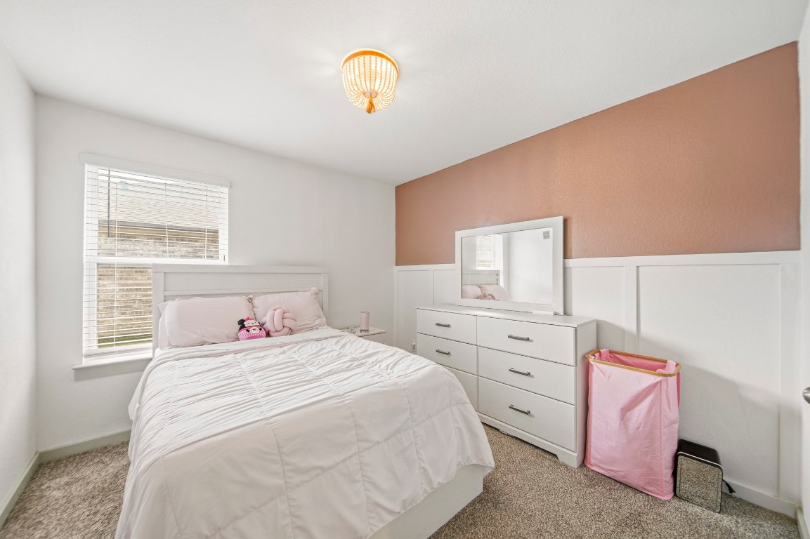 8210 Buck Lane Rosharon, TX 77583 - Photo 25 of 30 Comfortable bedroom with a functional layout and convenient storage space.