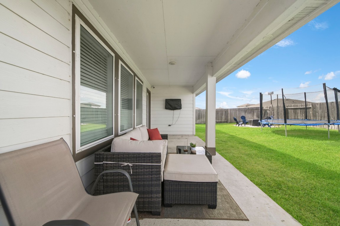 8210 Buck Lane Rosharon, TX 77583 - Photo 27 of 30 Covered patio space offering a comfortable setting for seating and outdoor enjoyment.