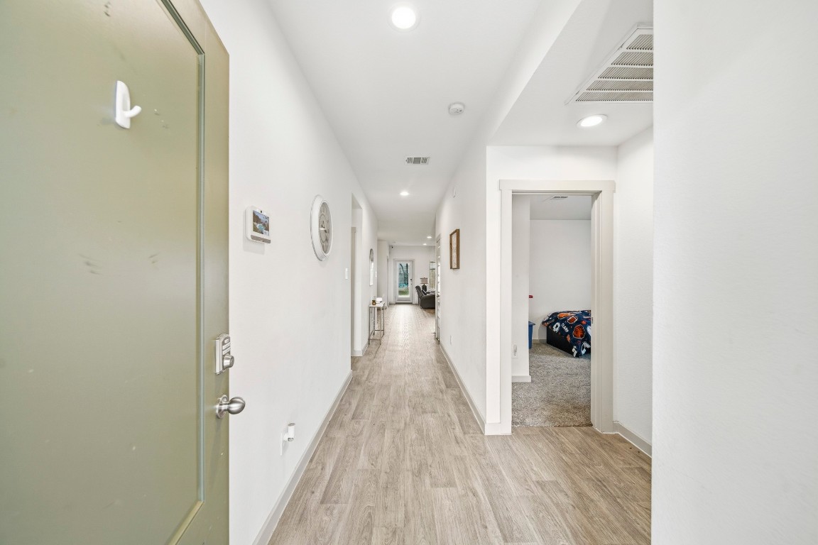 8210 Buck Lane Rosharon, TX 77583 - Photo 5 of 30 Long hallway layout providing easy access to multiple rooms throughout the home.