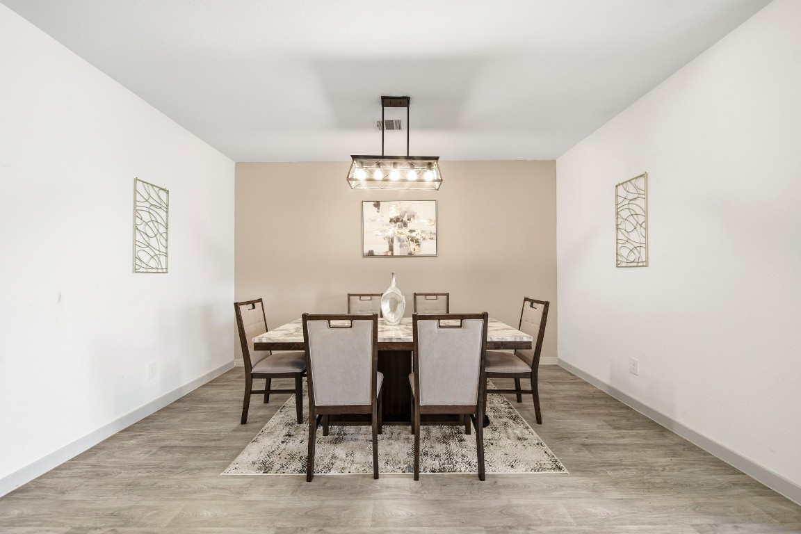 8210 Buck Lane Rosharon, TX 77583 - Photo 7 of 30 Spacious dining room with a functional layout for hosting.