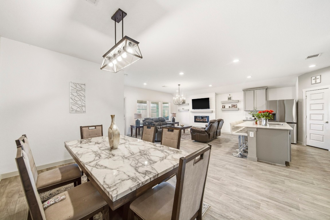 8210 Buck Lane Rosharon, TX 77583 - Photo 8 of 30 Dining area seamlessly connected to the kitchen and living space for easy entertaining.