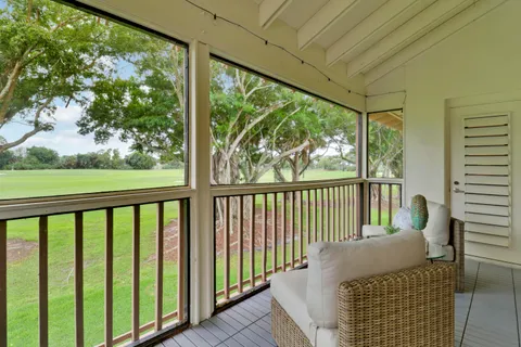 a balcony with chairs