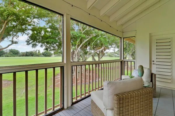 a balcony with chairs
