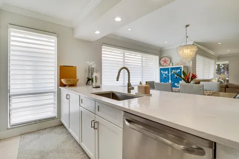 a kitchen with stainless steel appliances granite countertop a stove microwave and refrigerator