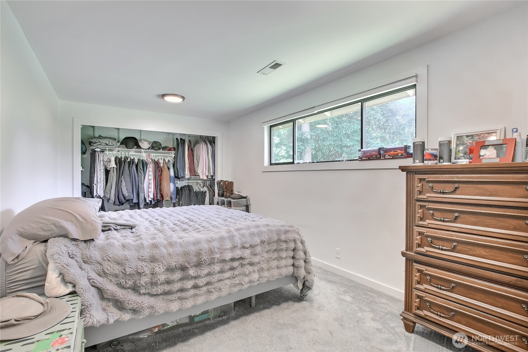 13610 Southeast 288th Street Kent, WA 98042 - Photo 11 of 32 a bedroom with a bed and a dresser next to a window