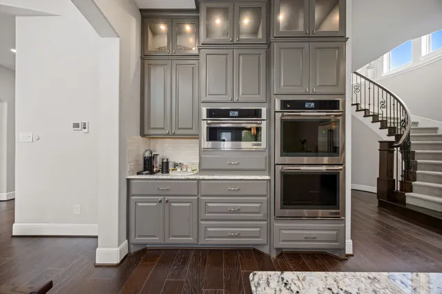 a kitchen with appliances and cabinets