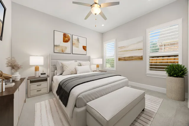 a bedroom with a large bed and a window