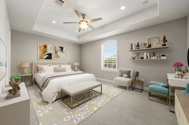 a spacious bedroom with a bed a couch and a window