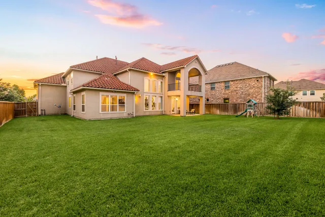 a front view of a house with a yard and porch