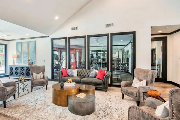 a living room with furniture and a large window
