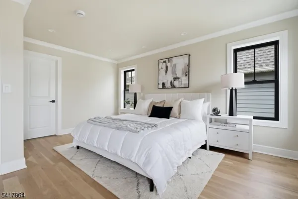 a bedroom with a bed and a lamp