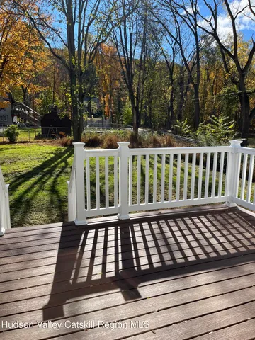 a view of a black white wooden bench