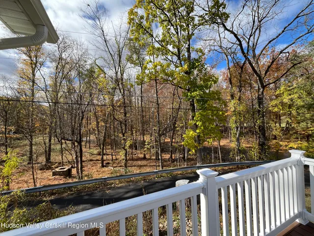 a view of street with wooden fence