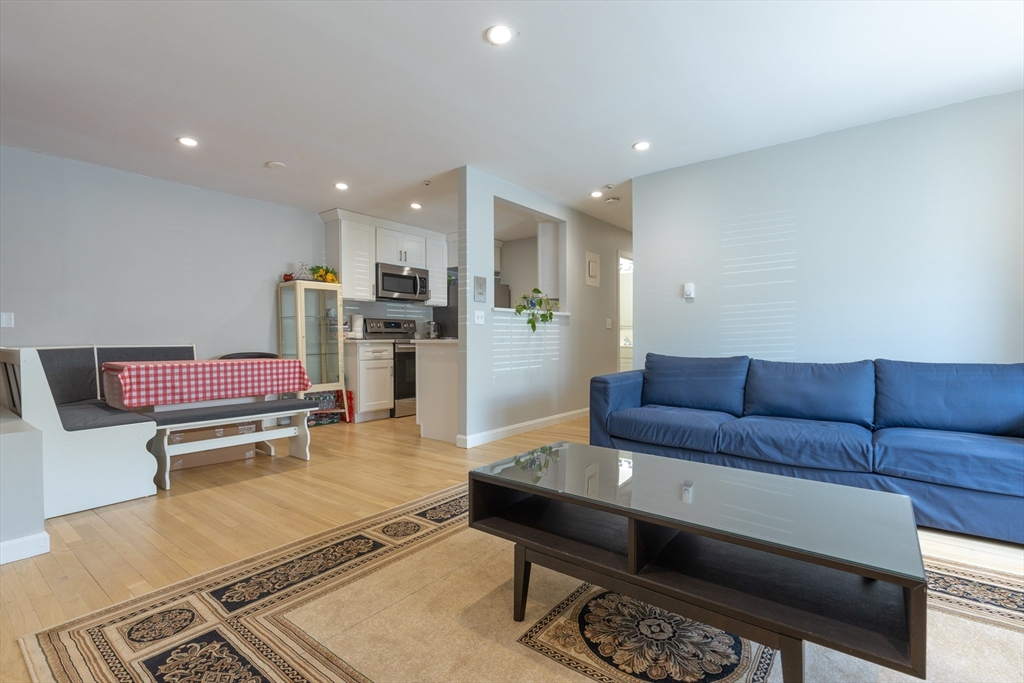 a living room with furniture and a table