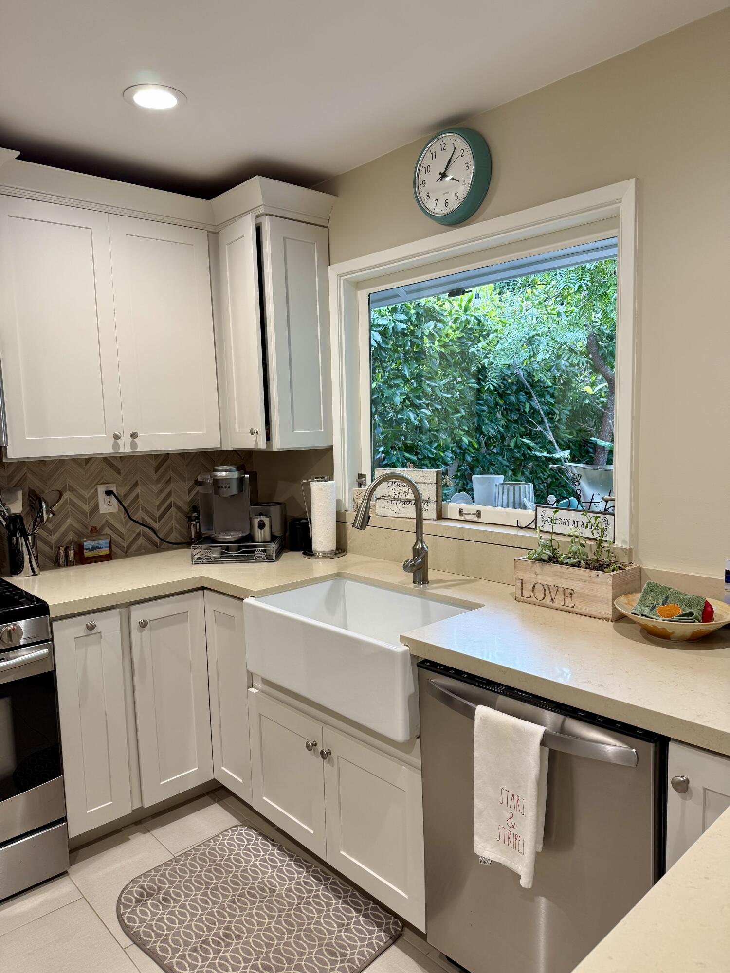 1353 Pacific Santa Barbara, CA 93109 - Photo 5 of 14 a kitchen with a sink window and cabinets
