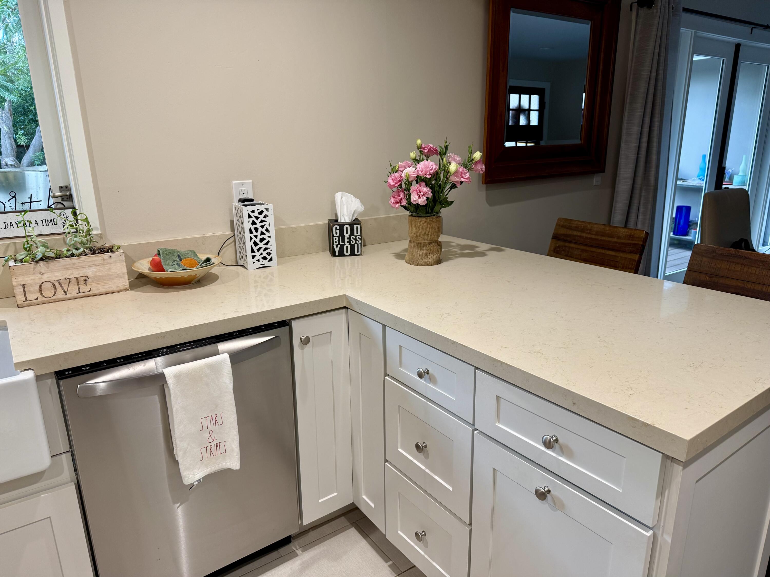 1353 Pacific Santa Barbara, CA 93109 - Photo 6 of 14 a utility room with cabinets washer and dryer