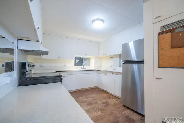 a kitchen with granite countertop a stove and a sink