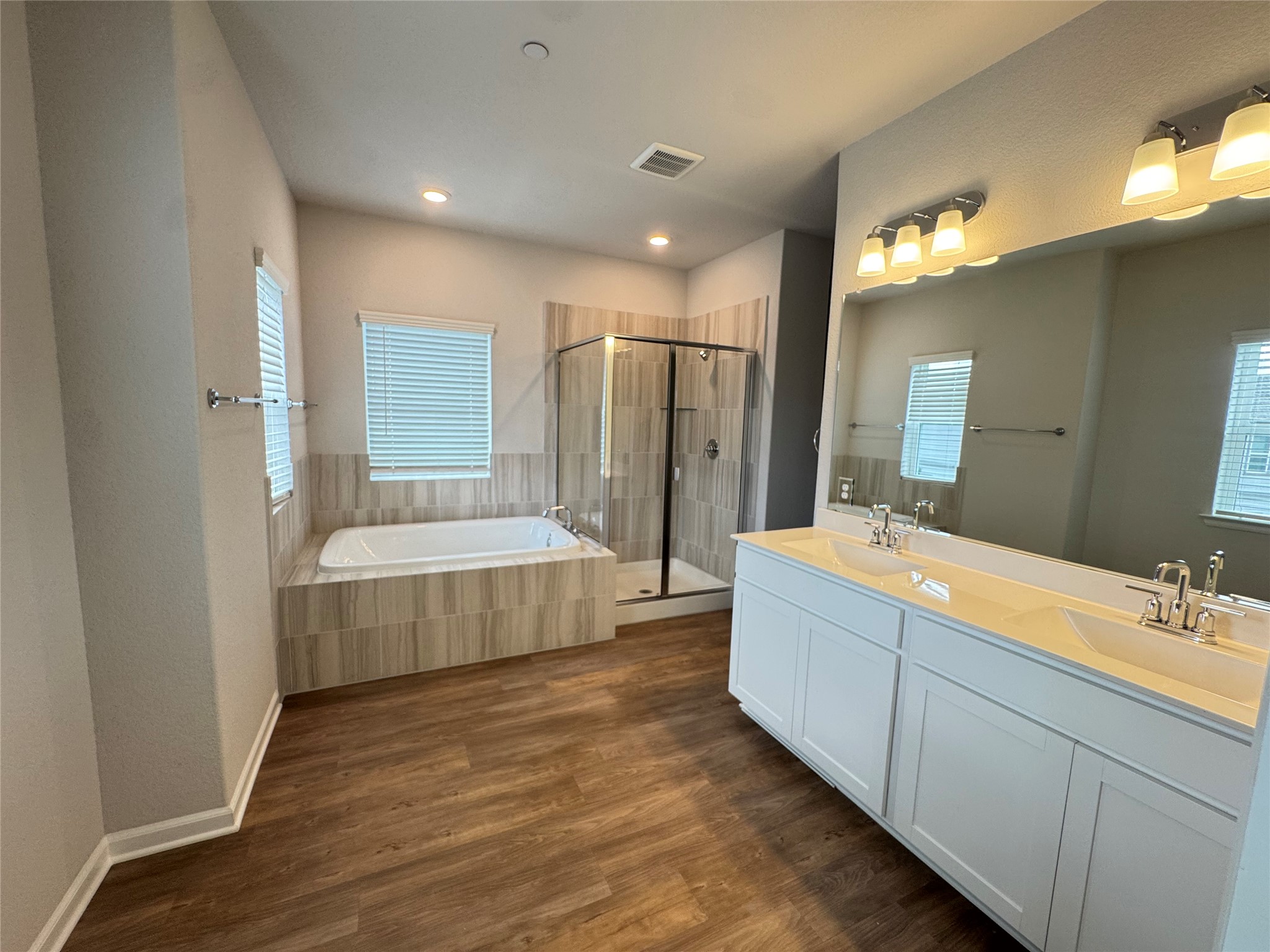 3000 Chisholm Trail Road, Unit 3 Round Rock, TX 78681 - Photo 14 of 28 a bathroom with a double vanity sink mirror and shower