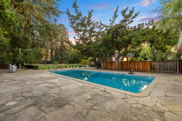 a view of swimming pool with patio