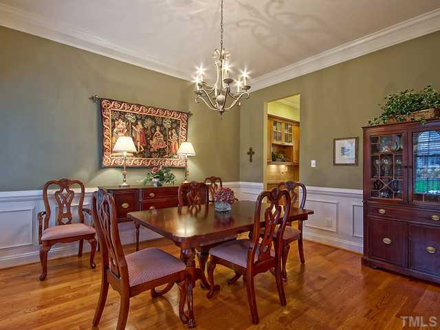 1812 Stannard Trail Raleigh, NC 27612 - Photo 4 of 25 This is a view of the dining room as it leads to the butler pantry. Notice the details in the deep, custom chair rail. Dining Room