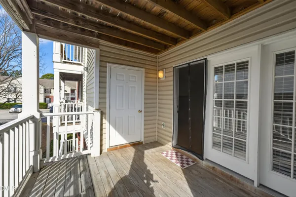a view of balcony with wooden floor