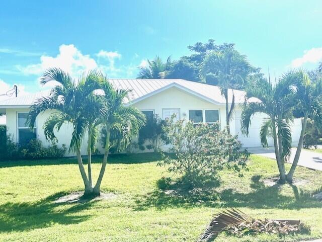 3665 Southeast Lower Street Stuart, FL 34997 - Photo 2 of 20 a view of a house with a yard