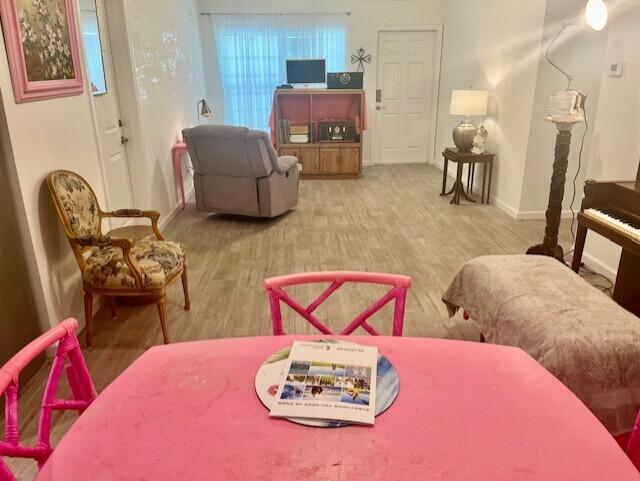 3665 Southeast Lower Street Stuart, FL 34997 - Photo 10 of 20 a living room with furniture and a wooden floor