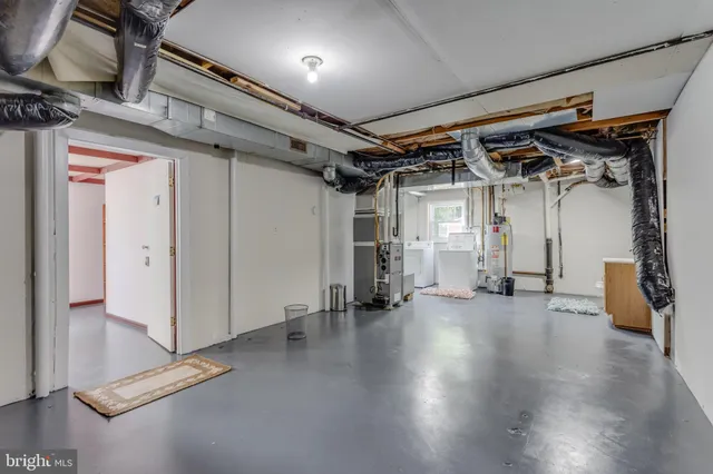 a view of a water heater room with a garage