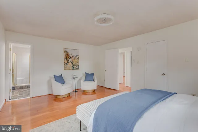 a bedroom with bed and window