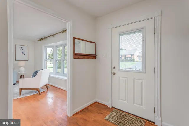 a view of a bedroom with furniture and a window