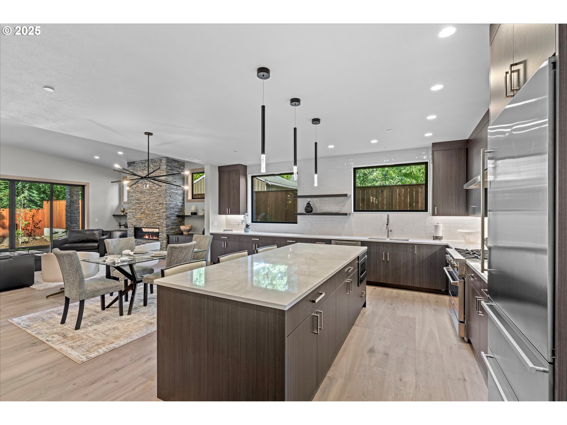 15003 Twin Fir Road Lake Oswego, OR 97035 - Photo 11 of 42 a kitchen with granite countertop a sink counter top space appliances and cabinets