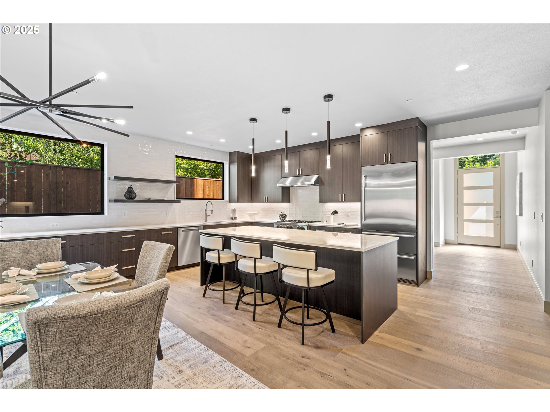 15003 Twin Fir Road Lake Oswego, OR 97035 - Photo 12 of 42 a living room with stainless steel appliances kitchen island granite countertop furniture and a kitchen view