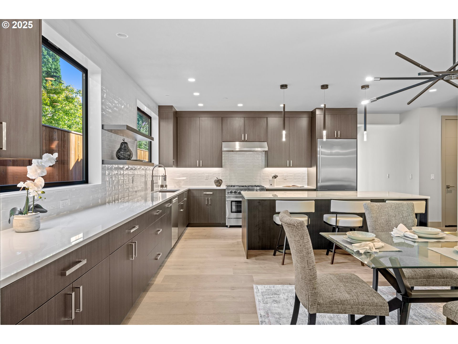 15003 Twin Fir Road Lake Oswego, OR 97035 - Photo 14 of 42 a open kitchen with lots of counter top space a sink stainless steel appliances and cabinets
